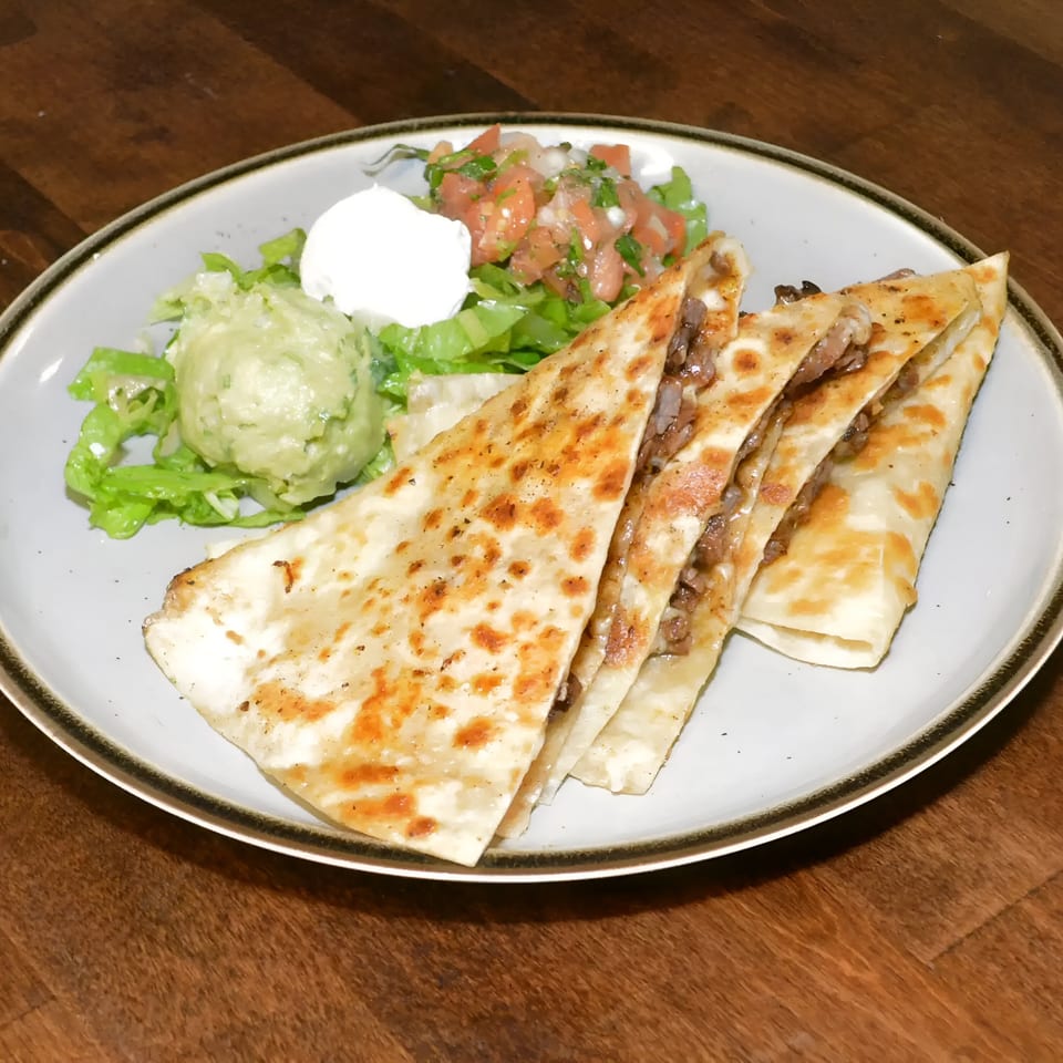La Costa Mexican cantina's quesadillas with guacamole, sour cream, and pico de gallo.